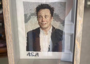 Young Palestinian woman mastered drawing characters with Palestinian embroidery